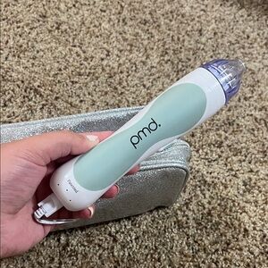 PMD Skincare Device in Mint and White
